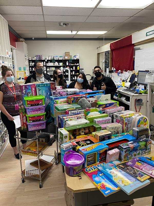 The Vesper team with a community toy drive